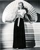 Carole and fan at full length c. 1941
