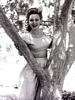 In a two-piece outfit with pearls (1943)