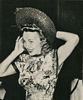 Trying on a Florell hat, Screenland September 1947
