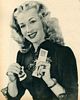 Cleaning her glasses, Screen Stars December 1946